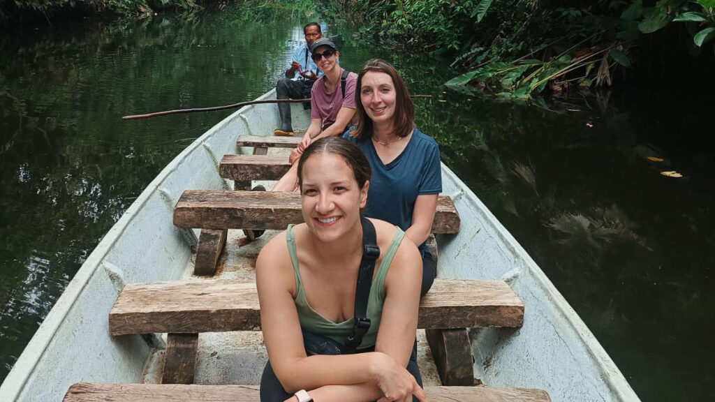 People enjoying their canoe ride in the lagoon during their amazon experience in Ecuador