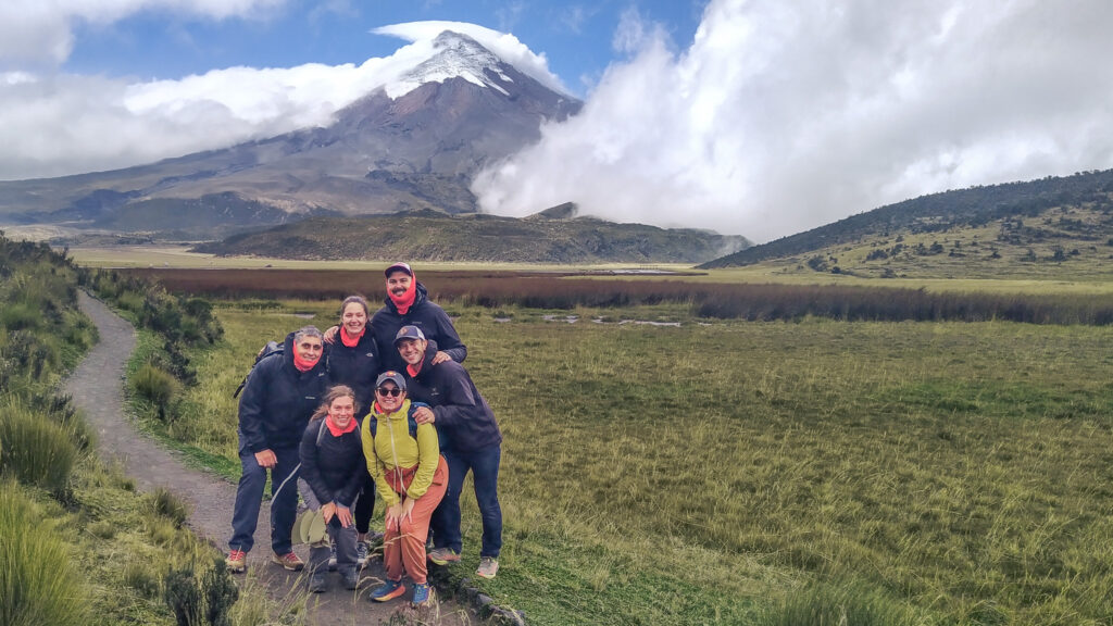People standing in front of cotopaxi volcano in Ecuador